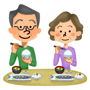 食事をする年配の夫婦